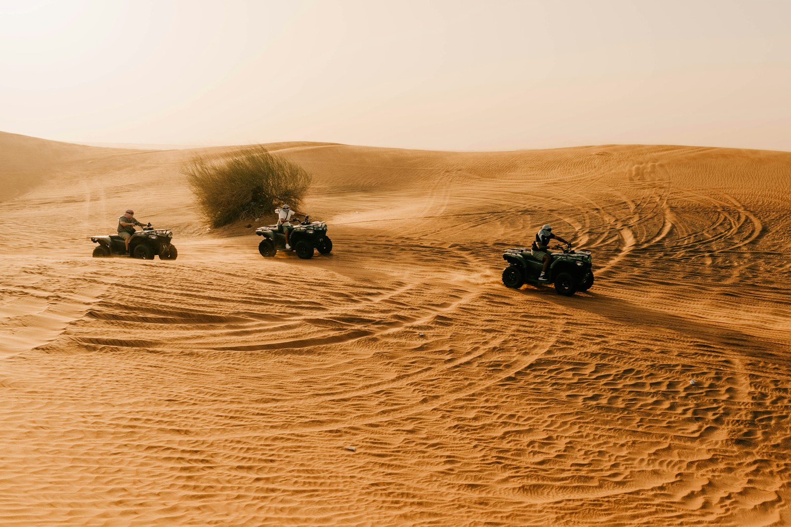 Quad bikes crossing the sand